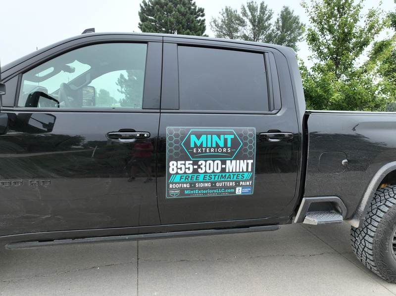 The Mint Exteriors sign on the side of the company truck